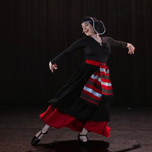 Professional dance teacher performing Acharuli dance in traditional Georgian costume