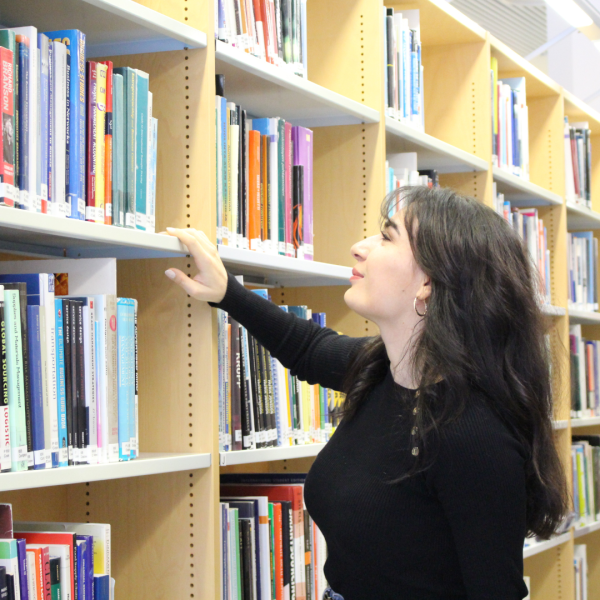 Nino Mikeladze - A young multilingual reader holding, representing the hero of the blog post about reading in multiple languages.